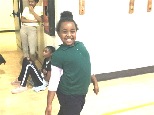 student in front of gym 1 